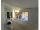 Open-concept living room with sliding doors leading to the outdoor patio area at 6608 Madeira Ave, Lakeland, FL 33811