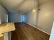 Living room with hardwood floors that opens up to the kitchen at 6608 Madeira Ave, Lakeland, FL 33811