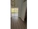 Living room showcasing sliding doors to backyard and hardwood floors at 6608 Madeira Ave, Lakeland, FL 33811