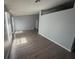 Bright living room features wood flooring, neutral paint, and lots of natural light at 6608 Madeira Ave, Lakeland, FL 33811