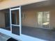 Covered and screened patio with tile flooring and sliding glass door access at 6608 Madeira Ave, Lakeland, FL 33811