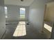 Bright room with freshly painted walls and natural light through the large windows at 6608 Madeira Ave, Lakeland, FL 33811
