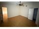 A spacious bedroom with hardwood floors, ceiling fan, and natural light at 6616 Shepherd Oaks St, Lakeland, FL 33811