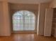 Cozy bedroom featuring a large window and a closet with shelving at 6616 Shepherd Oaks St, Lakeland, FL 33811