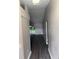 Inviting hallway leads to spacious living areas and features sleek, dark laminate flooring at 6616 Shepherd Oaks St, Lakeland, FL 33811