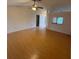 Spacious living room with hardwood floors and ceiling fan at 6616 Shepherd Oaks St, Lakeland, FL 33811