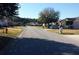 Neighborhood street view showcasing well-maintained lawns, sidewalks, and various home styles in a residential community at 6616 Shepherd Oaks St, Lakeland, FL 33811