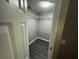 Cozy walk-in closet provides organized storage space with built-in wire shelving and light at 6616 Shepherd Oaks St, Lakeland, FL 33811