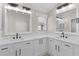 Bathroom with double sinks, white cabinets, quartz countertops, and modern fixtures at 7214 Se 171St Brookhaven Pl, The Villages, FL 32162