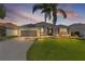 Charming home with a two-car garage, well-manicured lawn, and beautiful landscaping at 7214 Se 171St Brookhaven Pl, The Villages, FL 32162