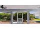 Screened-in patio with tiled floors and views of the backyard landscaping at 7214 Se 171St Brookhaven Pl, The Villages, FL 32162