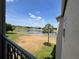 Balcony view overlooking community golf course, water feature, and sunny skies at 7320 Westpointe Blvd # 531, Orlando, FL 32835