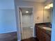 Bright bathroom featuring a tub with white tile surround and a vanity with a granite countertop at 7320 Westpointe Blvd # 531, Orlando, FL 32835