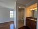 Bright bathroom featuring granite counters, vanity and a tub with white tile surround at 7320 Westpointe Blvd # 531, Orlando, FL 32835