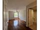 A bright bedroom with hardwood floors, a ceiling fan, and a window offering plenty of natural light at 7320 Westpointe Blvd # 531, Orlando, FL 32835