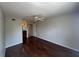 The spacious bedroom features hardwood flooring, a ceiling fan, and an ensuite bathroom at 7320 Westpointe Blvd # 531, Orlando, FL 32835