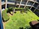 Overhead view of community courtyard featuring mature landscaping and a manicured lawn at 7320 Westpointe Blvd # 531, Orlando, FL 32835