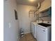 Practical laundry area with washer, dryer, shelving and handy drying rack for everyday convenience at 7320 Westpointe Blvd # 531, Orlando, FL 32835