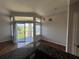 Dining area with pendant lighting, view of outdoor patio, and granite-topped breakfast bar at 7320 Westpointe Blvd # 531, Orlando, FL 32835