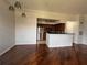 Open-concept living space features dark wood flooring, crown molding, and an eat-in kitchen with stainless steel appliances at 7320 Westpointe Blvd # 531, Orlando, FL 32835