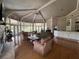 Bright open living room with fireplace, hardwood floors, and large windows offers comfortable space at 7320 Westpointe Blvd # 531, Orlando, FL 32835