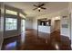 Spacious living room with hardwood floors, modern lighting and access to a balcony at 7320 Westpointe Blvd # 531, Orlando, FL 32835