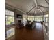 Bright open living room with fireplace, hardwood floors, and large windows offers comfortable space at 7320 Westpointe Blvd # 531, Orlando, FL 32835