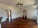 Spacious living room with hardwood floors and plenty of natural light at 7320 Westpointe Blvd # 531, Orlando, FL 32835