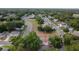 Aerial view of a neighborhood with trees, houses and roadways at 901 Cascades Park Trl, Deland, FL 32720