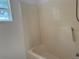 Bathroom features a standard bathtub with tile surround and a window at 901 Cascades Park Trl, Deland, FL 32720
