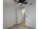 Bright bedroom with a ceiling fan and closet at 901 Cascades Park Trl, Deland, FL 32720
