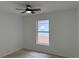 This bedroom features a ceiling fan and a window overlooking the outside at 901 Cascades Park Trl, Deland, FL 32720