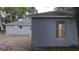 Rear exterior view of the home showcases the windows and roof at 901 Cascades Park Trl, Deland, FL 32720