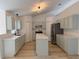 Well-equipped kitchen with stainless appliances, an island, and lots of cabinet space at 901 Cascades Park Trl, Deland, FL 32720