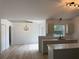 Modern kitchen featuring stainless steel appliances, an island, and stylish pendant lighting at 901 Cascades Park Trl, Deland, FL 32720