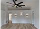 Spacious living area with modern ceiling fan, recessed lighting, and wood-look flooring at 901 Cascades Park Trl, Deland, FL 32720