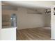 Open concept living area with kitchen view, modern fixtures, and bright natural light at 901 Cascades Park Trl, Deland, FL 32720