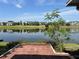 Beautiful lake view from the brick paved patio, offering serene waterfront living at 904 W Charing Cross Cir, Lake Mary, FL 32746