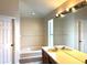 Well-lit bathroom featuring double vanity, soaking tub, and neutral color scheme at 904 W Charing Cross Cir, Lake Mary, FL 32746