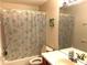 Bathroom featuring tub with shower and tile backsplash at 904 W Charing Cross Cir, Lake Mary, FL 32746