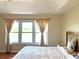 Bright bedroom with a large window offering a scenic lake view at 904 W Charing Cross Cir, Lake Mary, FL 32746