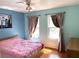 Bright bedroom featuring a large window with an outside view at 904 W Charing Cross Cir, Lake Mary, FL 32746
