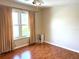 Cozy bedroom with ceiling fan and nice hard wood flooring at 904 W Charing Cross Cir, Lake Mary, FL 32746