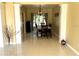 Dining room features tile floors, columns, updated lighting and a large window for natural light at 904 W Charing Cross Cir, Lake Mary, FL 32746