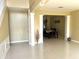 Bright foyer features tile floors, white trim and leads to the dining area with chandelier lighting at 904 W Charing Cross Cir, Lake Mary, FL 32746
