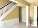 Open-concept foyer with tile floors, chair rail and staircase to the second floor at 904 W Charing Cross Cir, Lake Mary, FL 32746