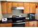 Modern kitchen features stainless appliances, granite countertops and wood cabinetry at 904 W Charing Cross Cir, Lake Mary, FL 32746