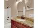 Bathroom features a granite countertop, single vanity, and bathtub with shower at 9668 Hollyhill Dr, Orlando, FL 32824