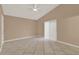 Spacious neutral bedroom features tile floors, vaulted ceilings, and a closet with sliding doors at 9668 Hollyhill Dr, Orlando, FL 32824