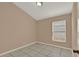 Neutral bedroom features tile floors and a window at 9668 Hollyhill Dr, Orlando, FL 32824
